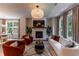 Stylish living room showcasing a fireplace, comfortable seating, and seamless flow to the dining area at 842 Bridgewater Sw St, Atlanta, GA 30310