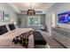 Bright main bedroom with tray ceiling, sitting area, and a large window view at 842 Bridgewater Sw St, Atlanta, GA 30310