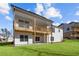 Backyard view showing two-story deck with covered patio, overlooking the lawn at 2023 Fern Mountain Ln, Marietta, GA 30064