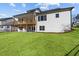 Large backyard with lush green grass and a two-story deck, perfect for outdoor entertaining at 2023 Fern Mountain Ln, Marietta, GA 30064