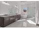 Bathroom with a double vanity, white marble floors, and a separate shower and tub at 2023 Fern Mountain Ln, Marietta, GA 30064