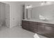 Modern bathroom featuring a double vanity, white marble floors, and a separate toilet room at 2023 Fern Mountain Ln, Marietta, GA 30064