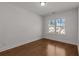 Light and airy bedroom with hardwood floors and a view of the neighborhood at 2023 Fern Mountain Ln, Marietta, GA 30064