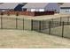 Spacious grassy backyard is enclosed by a black metal fence at 2925 Coach River Way, Cumming, GA 30040