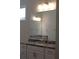 Bathroom featuring a granite vanity with dual faucets at 2925 Coach River Way, Cumming, GA 30040