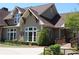 Elegant clubhouse features stone accents, large windows, and manicured landscaping at 2925 Coach River Way, Cumming, GA 30040