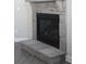Elegant stone fireplace with a raised hearth, adding warmth and character to the living space at 2925 Coach River Way, Cumming, GA 30040