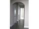 Spacious hallway with doors and dark flooring, providing access to various rooms at 2925 Coach River Way, Cumming, GA 30040