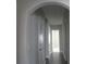 Hallway with gray walls, white trim and dark floors leading to bedrooms at 2925 Coach River Way, Cumming, GA 30040