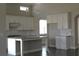 Bright kitchen featuring white cabinets, granite countertops, subway tile backsplash, and a center island at 2925 Coach River Way, Cumming, GA 30040