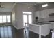 Open concept kitchen with stainless steel appliances, a center island, and an adjoining dining or living area at 2925 Coach River Way, Cumming, GA 30040