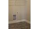 This laundry room features tile floors, utility hookups, and a wire rack shelving system at 2925 Coach River Way, Cumming, GA 30040