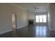Spacious living room with hardwood floors, a corner fireplace, and ample natural light at 2925 Coach River Way, Cumming, GA 30040