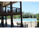 A two-story clubhouse overlooks a well-maintained pool with lounge seating at 2925 Coach River Way, Cumming, GA 30040
