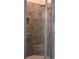 This shower features grey tile and a built-in seat, offering a luxurious and modern bathing experience at 2925 Coach River Way, Cumming, GA 30040
