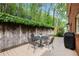 Outdoor living space featuring a wood deck, outdoor table, and a grill at 297 Breeze Hill Ln, Canton, GA 30114