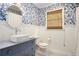 Chic bathroom with floral wallpaper, modern sink, and tiled floors at 297 Breeze Hill Ln, Canton, GA 30114