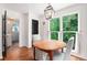 Bright breakfast nook featuring a wood table, large windows, and views of the surrounding greenery at 297 Breeze Hill Ln, Canton, GA 30114