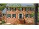 Charming brick home with black shutters and a well-maintained front yard at 297 Breeze Hill Ln, Canton, GA 30114