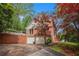 Brick two-story home with attached two-car garage, surrounded by lush landscaping at 297 Breeze Hill Ln, Canton, GA 30114