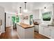 Bright kitchen with white cabinets, butcher block island and eat-in area at 297 Breeze Hill Ln, Canton, GA 30114