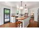 Bright kitchen with stainless steel appliances, butcher block island, and backyard access at 297 Breeze Hill Ln, Canton, GA 30114