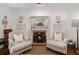 Inviting living room with a fireplace and comfortable seating arrangement, perfect for relaxing at 297 Breeze Hill Ln, Canton, GA 30114