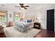 Spacious primary bedroom featuring a comfortable bed, ample natural light, and elegant decor at 297 Breeze Hill Ln, Canton, GA 30114