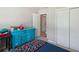 A cozy bedroom featuring a blue dresser and a view of the closet at 3925 Chicamauga Ne Dr, Kennesaw, GA 30144