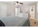 Spacious bedroom featuring a large dresser and a bed with a gray patterned comforter at 3925 Chicamauga Ne Dr, Kennesaw, GA 30144