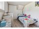 Cozy bedroom with wood-look floors and sloped ceilings, offering a peaceful retreat at 3925 Chicamauga Ne Dr, Kennesaw, GA 30144