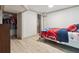 A tidy bedroom with ample closet space, featuring modern wood-look flooring and neutral wall colors at 3925 Chicamauga Ne Dr, Kennesaw, GA 30144