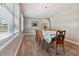 Bright dining room with wood floors, featuring a rustic light fixture and decorative touches at 3925 Chicamauga Ne Dr, Kennesaw, GA 30144