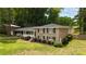 Charming brick home with a manicured lawn, neat landscaping, and a covered carport, exuding curb appeal at 3925 Chicamauga Ne Dr, Kennesaw, GA 30144