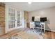Well-lit home office space featuring hardwood floors, French doors, and a functional workstation at 3925 Chicamauga Ne Dr, Kennesaw, GA 30144