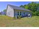 Spacious backyard featuring a small patio and ample green space for outdoor activities at 1014 Starmoss Ln, Conyers, GA 30094