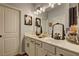 Bathroom with double sink vanity, framed mirrors, drawers, and storage at 1014 Starmoss Ln, Conyers, GA 30094