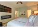 Main bedroom with a sleek fireplace, neutral walls, and access to other rooms at 1014 Starmoss Ln, Conyers, GA 30094
