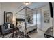 Bedroom featuring a four-poster bed, neutral carpet and decor at 1014 Starmoss Ln, Conyers, GA 30094