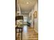 Hallway with wood floors and decorative lighting fixtures leading to the front door at 1014 Starmoss Ln, Conyers, GA 30094