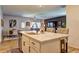 Open kitchen and dining area with stainless steel appliances and island with barstool seating at 1014 Starmoss Ln, Conyers, GA 30094