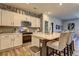 Modern kitchen featuring white cabinets, stainless steel appliances, quartz countertops and bar seating at 1014 Starmoss Ln, Conyers, GA 30094