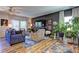 Inviting living room with hardwood floors, stylish furniture, and a ceiling fan at 1014 Starmoss Ln, Conyers, GA 30094