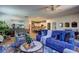 Open-concept living room with decorative wallpaper, contemporary furniture, and view of the kitchen at 1014 Starmoss Ln, Conyers, GA 30094