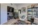 Living room featuring plush seating, shelves, contemporary decor and a fluffy rug at 1014 Starmoss Ln, Conyers, GA 30094