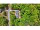 Stunning aerial view of a home nestled in lush greenery with a winding driveway at 125 Abner Dr, Mcdonough, GA 30252