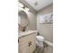 Powder room featuring a decorative mirror, stone countertop, and modern toilet at 125 Abner Dr, Mcdonough, GA 30252