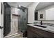 Modern bathroom featuring tiled shower, granite counter and black fixtures at 125 Abner Dr, Mcdonough, GA 30252