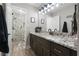 Bathroom with stone-look countertop, black faucet, and tiled walk-in shower at 125 Abner Dr, Mcdonough, GA 30252