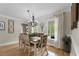 Dining room features a modern chandelier and lots of natural light at 125 Abner Dr, Mcdonough, GA 30252